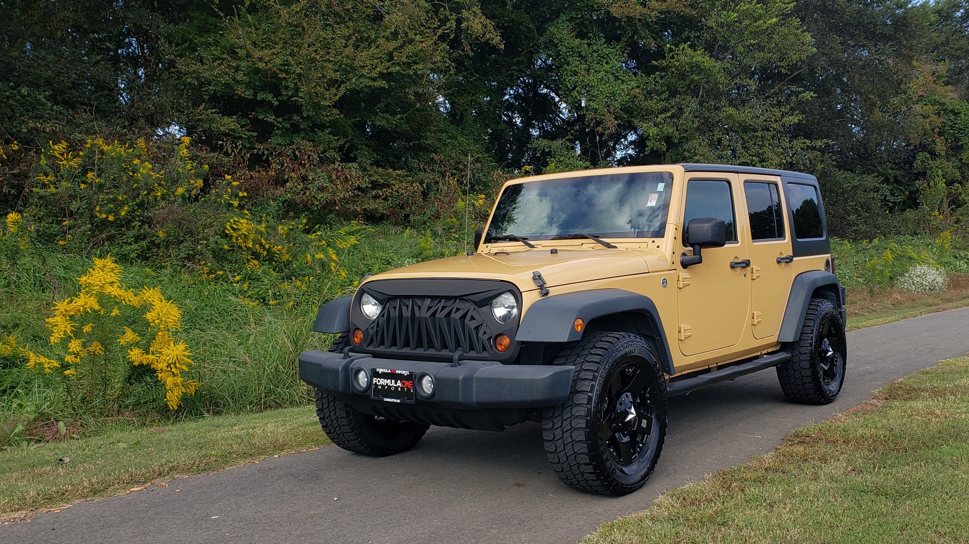 Used 2013 Jeep WRANGLER UNLIMITED SPORT 4X4 / 3.6L V6 / 5-SPD AUTO / 3-PC FREEDOM TOP for sale Sold at Formula Imports in Charlotte NC 28227 4