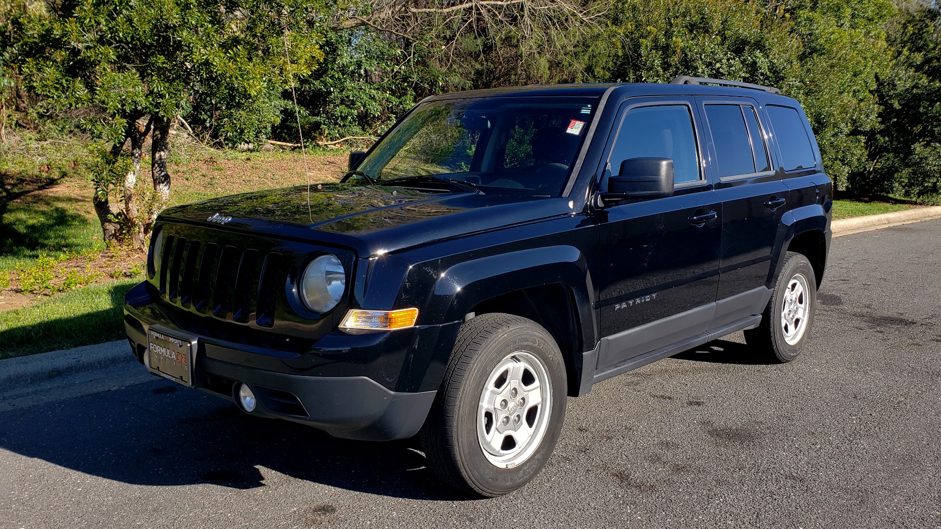 Used 2014 Jeep PATRIOT SPORT / 4WD 4-DR / POWER VALUE GRP / 4-CYL / 6-SPD AUTO for sale Sold at Formula Imports in Charlotte NC 28227 1